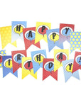 A assortment of colorful birthday banners with the words 'HAPPY BIRTHDAY!' in comic book style lettering, attached to a string.
